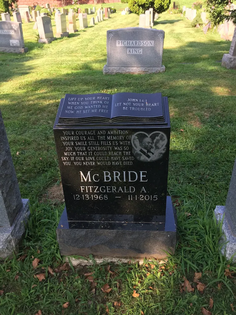 Laser-etched portrait on black granite headstone